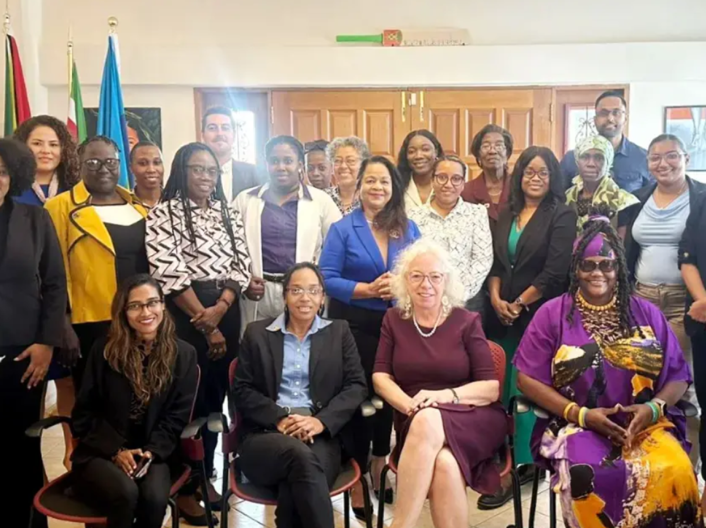 A group of people, some standing and some seated.