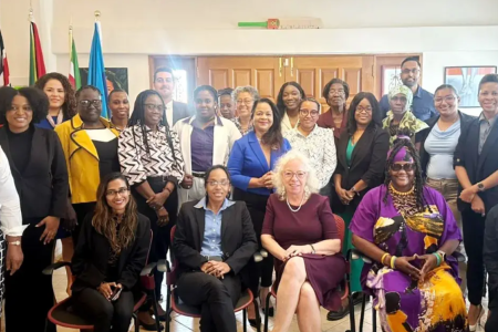 A group of people, some standing and some seated.