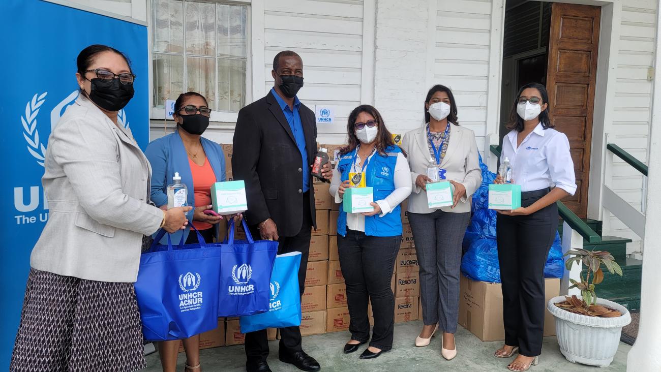 UNHCR hands over donation of cleaning supplies, protective equipment to Ministry of Education in Guyana.
