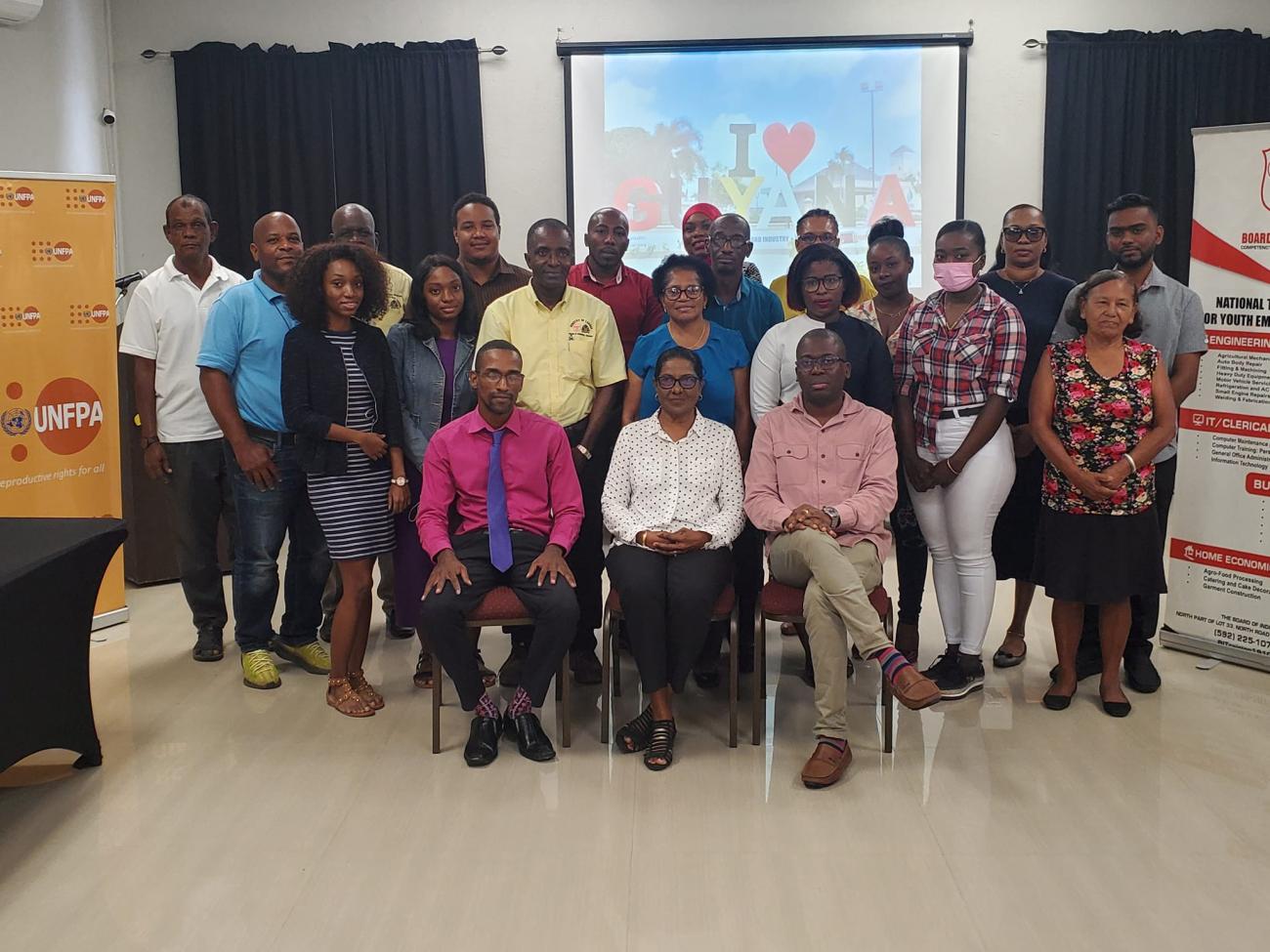 A group of people sitting and standing. They are participants of the training hosted by the Board of Industrial Training in collaboration with UNFPA