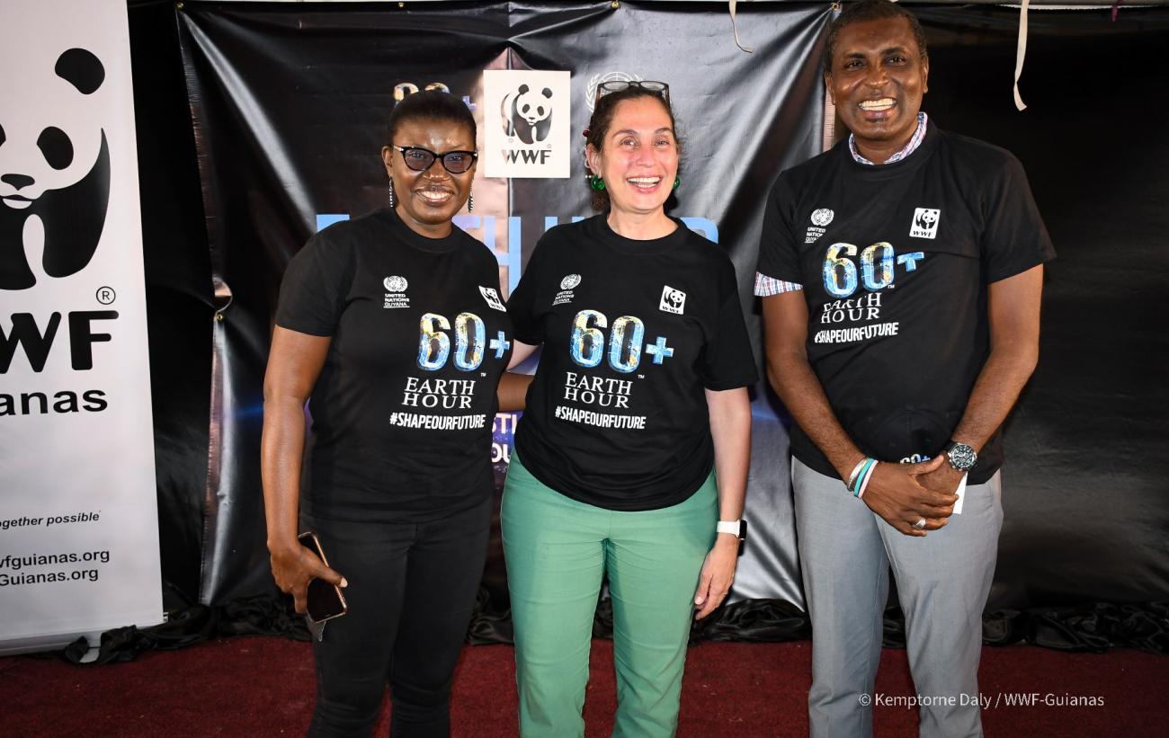 Yeşim Oruç, UN Resident Coordinator (center) with Aiesha Williams, Country Manager, WWF-Guianas; and Alfred Mentore, Deputy Mayor of Georgetown at Earth Hour 2022.