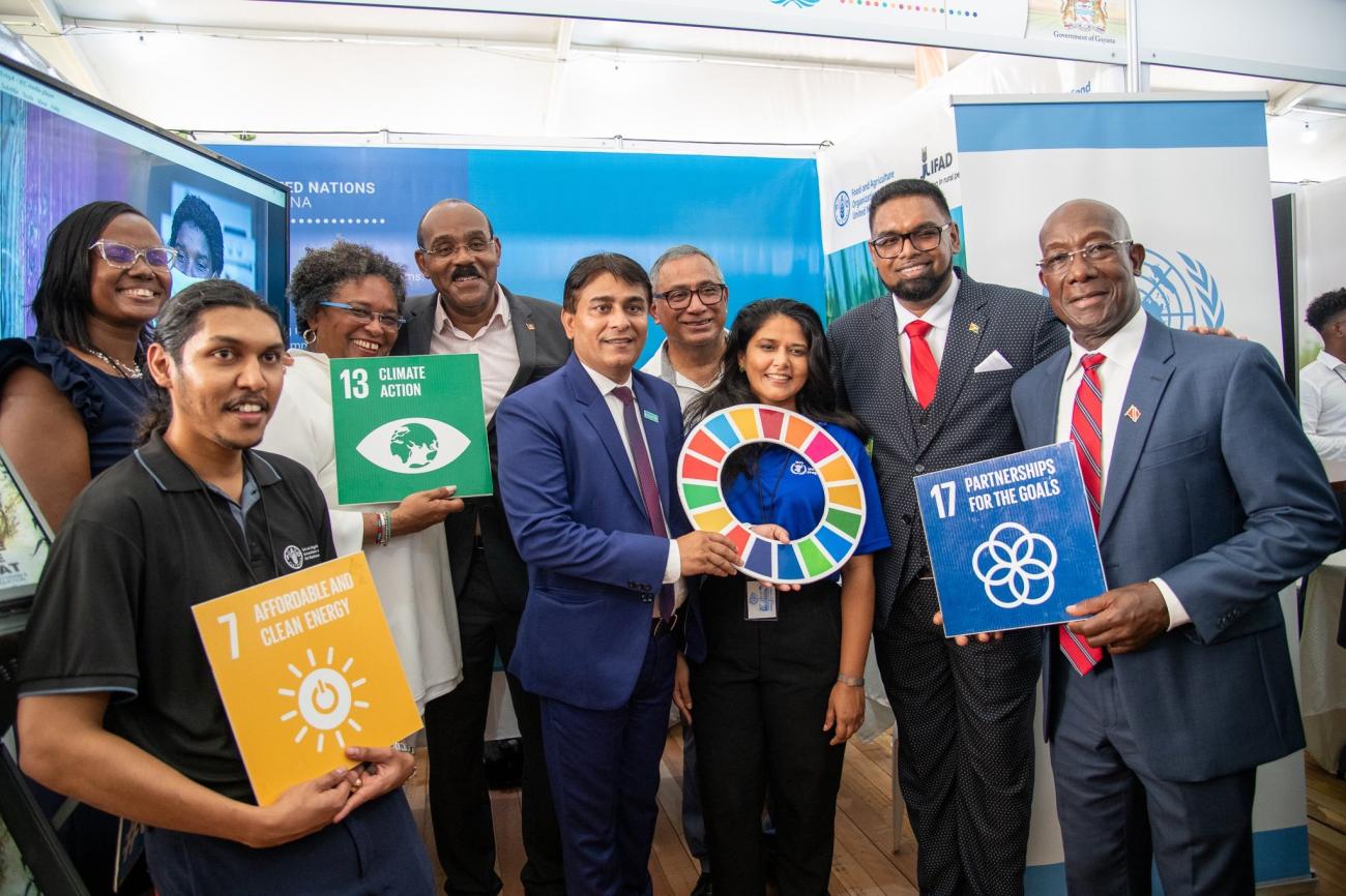 H.E. President Dr. Mohamed Irfaan Ali (second from right) and Prime Ministers Mia Amor Mottley (Barbados), Gaston Browne (Antigua and Barbuda), Hon. John Briceno (Belize), and Dr Keith Rowley (Trinidad and Tobago), with UN UNICEF Deputy Representative, Irfan Akhtar and staff from FAO, WFP, and the Office of the UN Resident Coordinator at the UN booth during the Agri-Investment Forum.