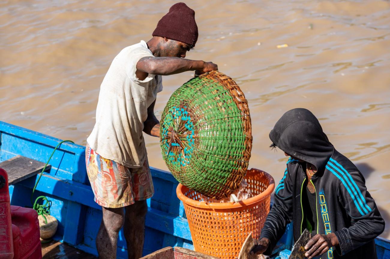 Two men on a fishing vessel