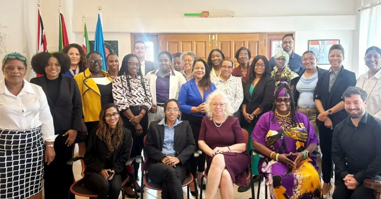 A group of people, some standing and some seated.