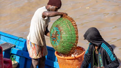 Two men on a fishing vessel