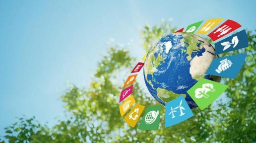 Photo of the globe with icons of the Sustainable Development Goals surrounding it.