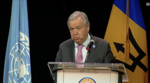 A man standing at a podium speaking.