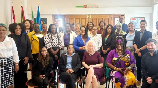 A group of people, some standing and some seated.